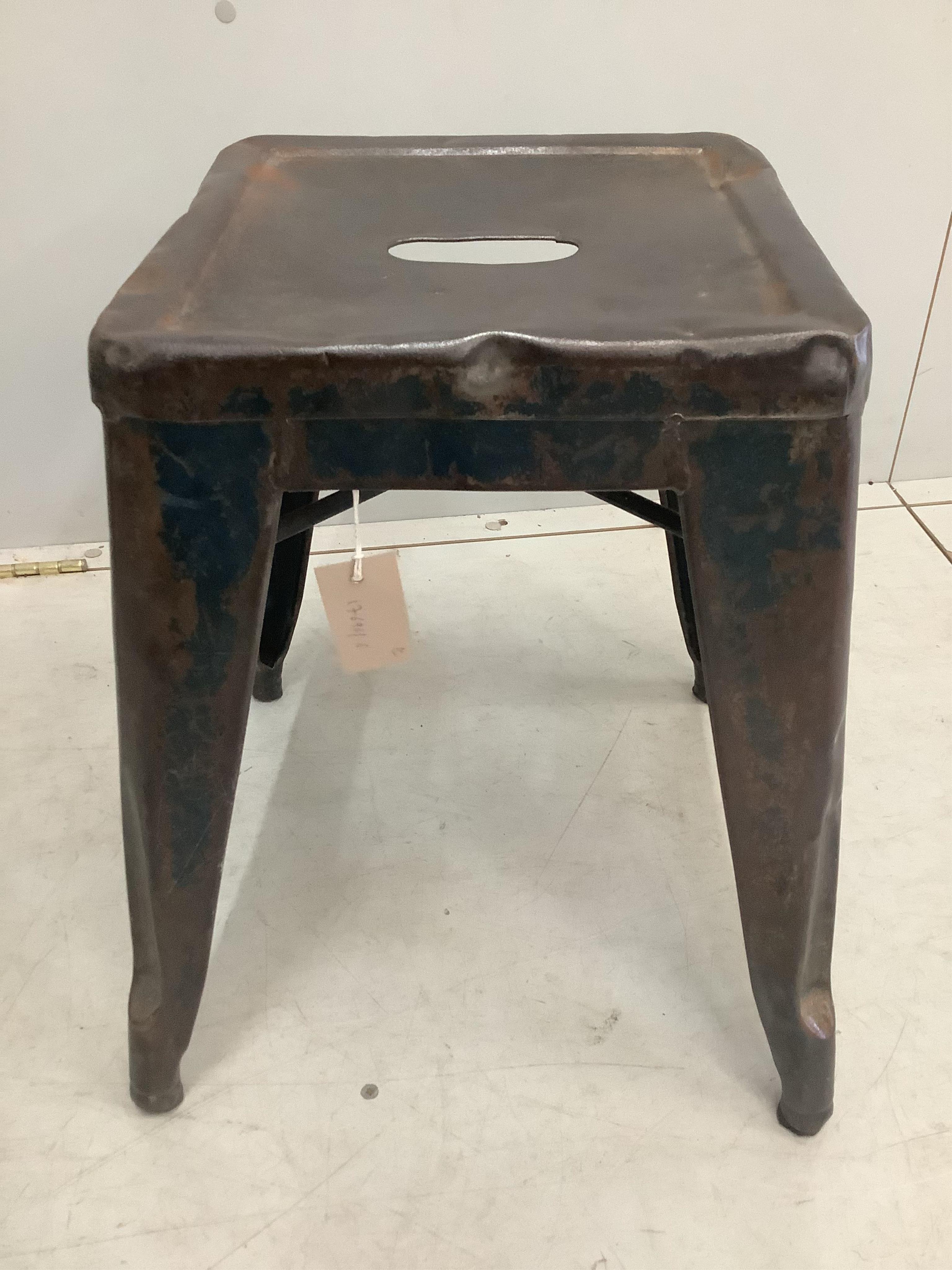 A pair of Tolix vintage industrial style metal stools, width 39cm, height 44cm